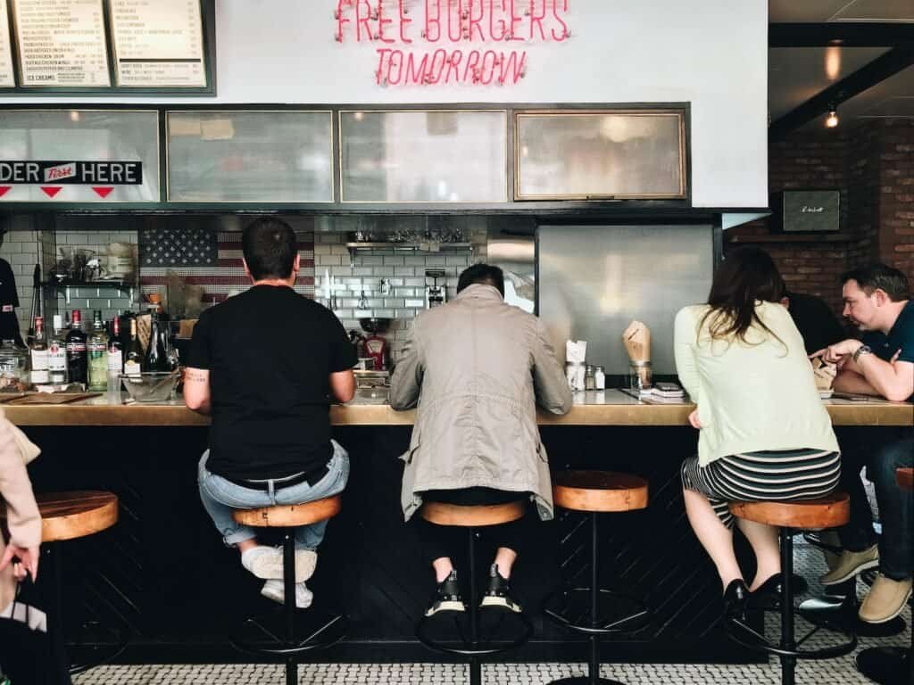 man and woman standing in front of counter